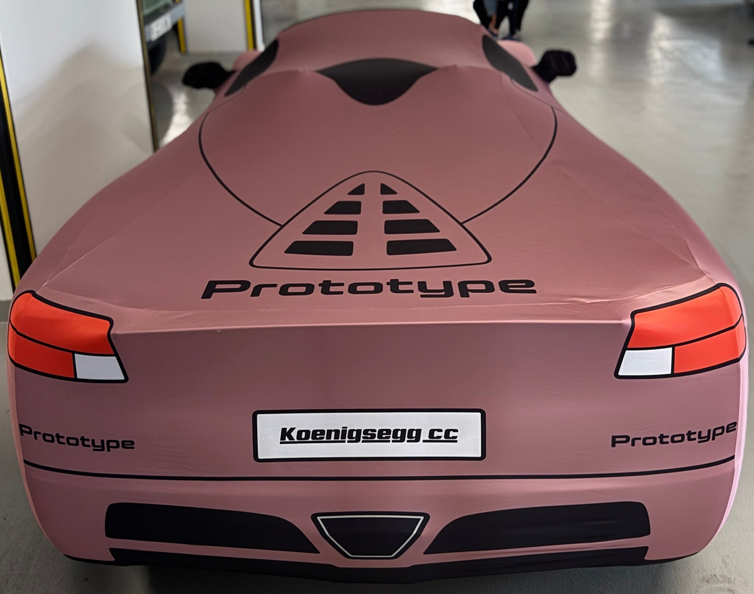 Koenigsegg CC prototype rear image under a TyreDox indoor cover